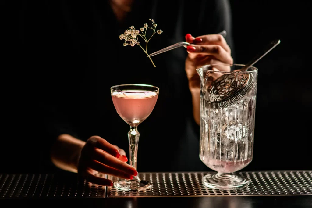 Image of speciality cocktail with flower prepared by V private bartender services