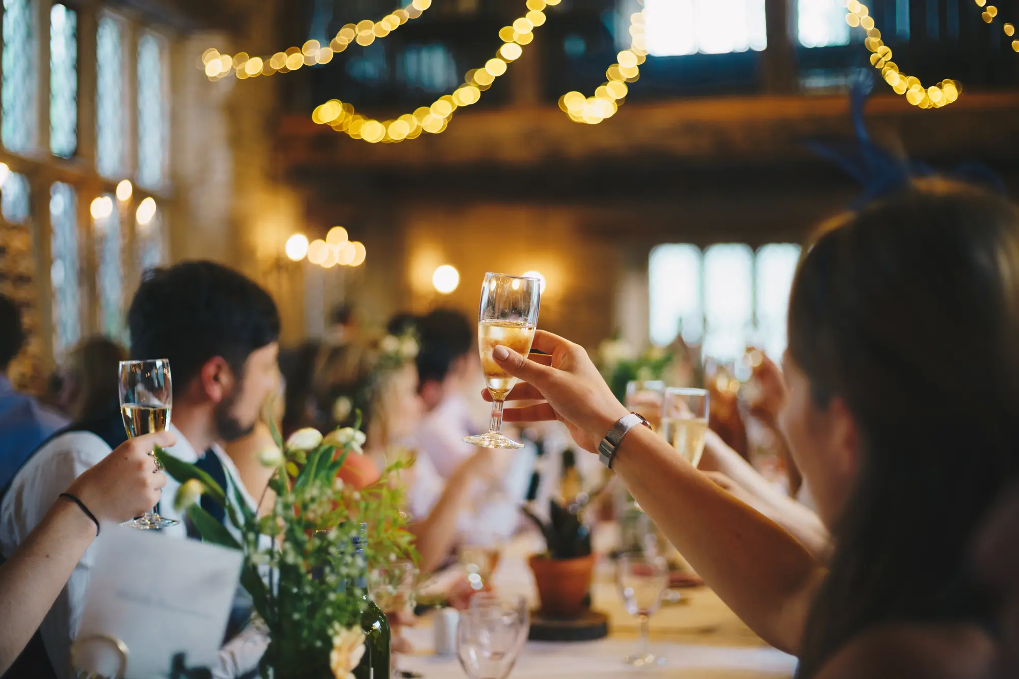 Image of people toasting during wedding that was using private bartender service